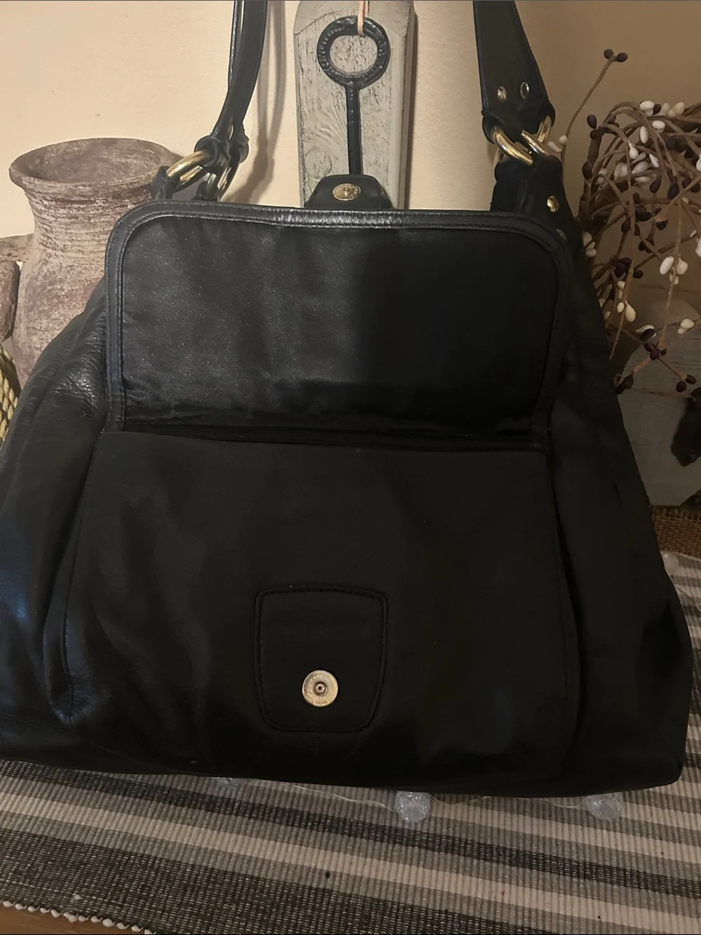 Coach Black Leather Shoulder Bag with Front Buckle Pocket and Gold Hardware